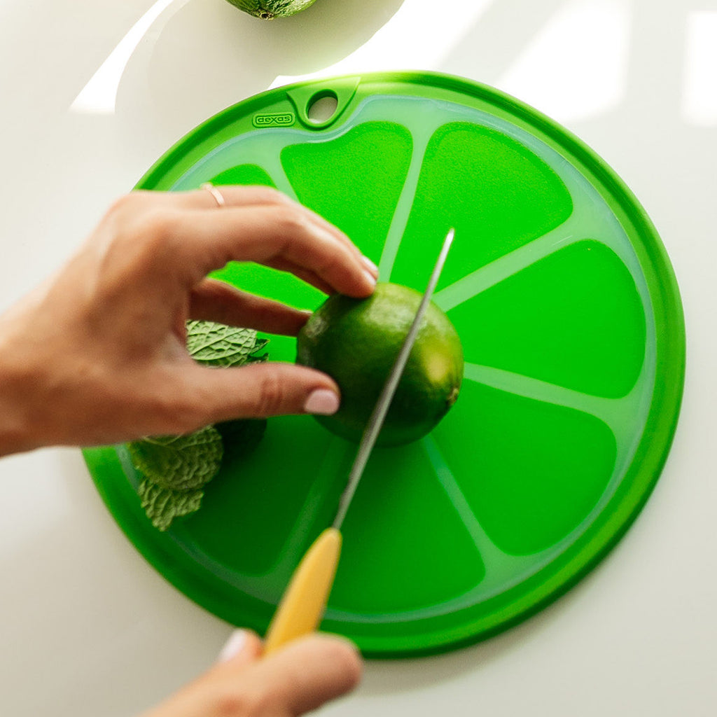 Fresh Sliced Citrus Fruits On Cutting Board With Wooden Squeezer Stock  Photo, Picture and Royalty Free Image. Image 54964192.